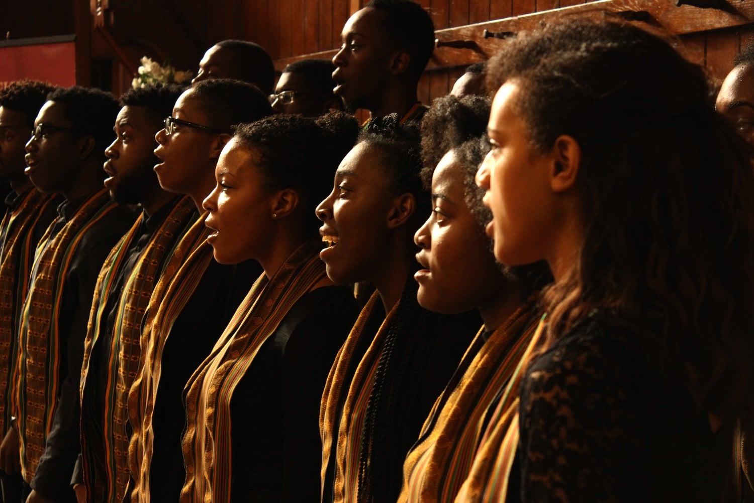 The Kuumba Singers of Harvard College sing in Annenberg Hall at the unveiling ceremony.