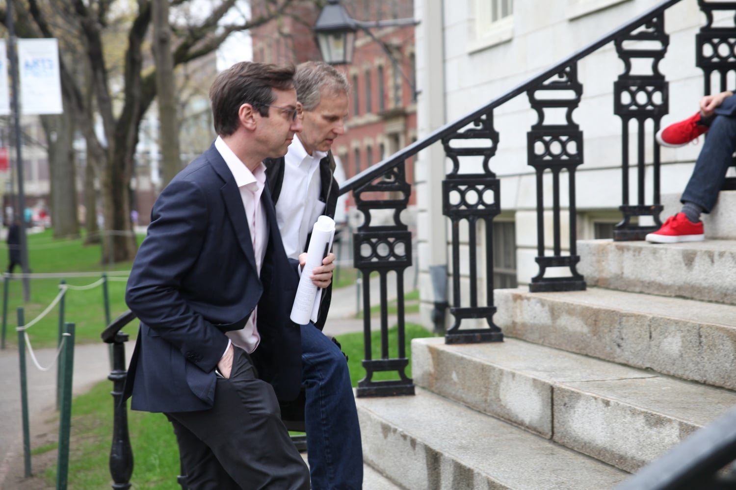 David I. Laibson ’88, chair of the Economics Department, and Jeffrey A. Myron, the department’s director of undergraduate studies, head into University Hall on Tuesday afternoon for a Faculty meeting.