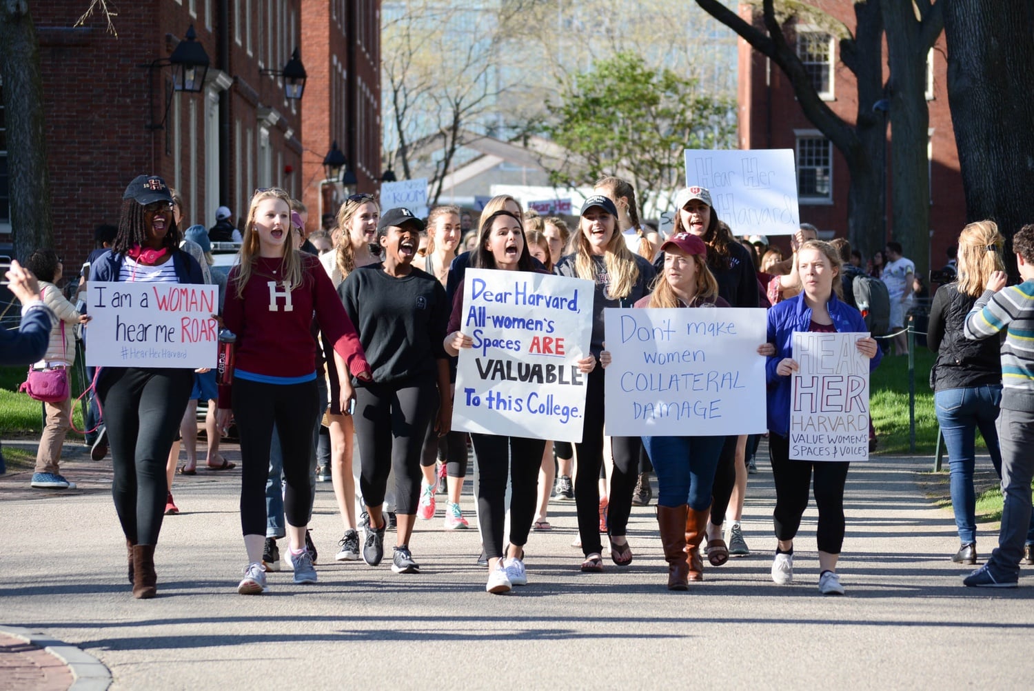 Undergraduate women involved in sororities and female final clubs took to Harvard Yard in protest of the announcements on unrecognized single-gender social groups last year.