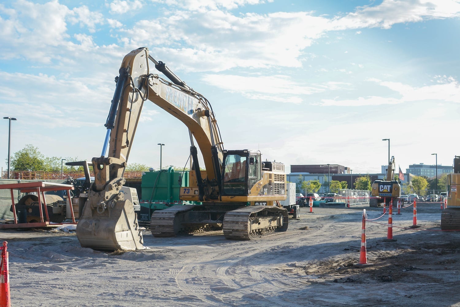 Facing the Harvard Innovation Lab, an excavator stands still on the Harvard Business School campus in May 2016. The construction site is part of the larger effort to expand Harvard's facilities to Allston areas. 