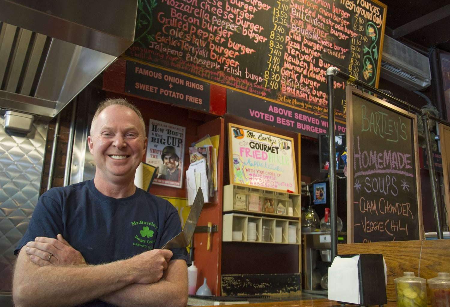 Bill Bartley, owner of Bartley's Burger Cottage, poses in his Massachusetts Avenue restaurant. Bartley's, as the restaurant is affectionately known, has been in Harvard Square for over 50 years. 