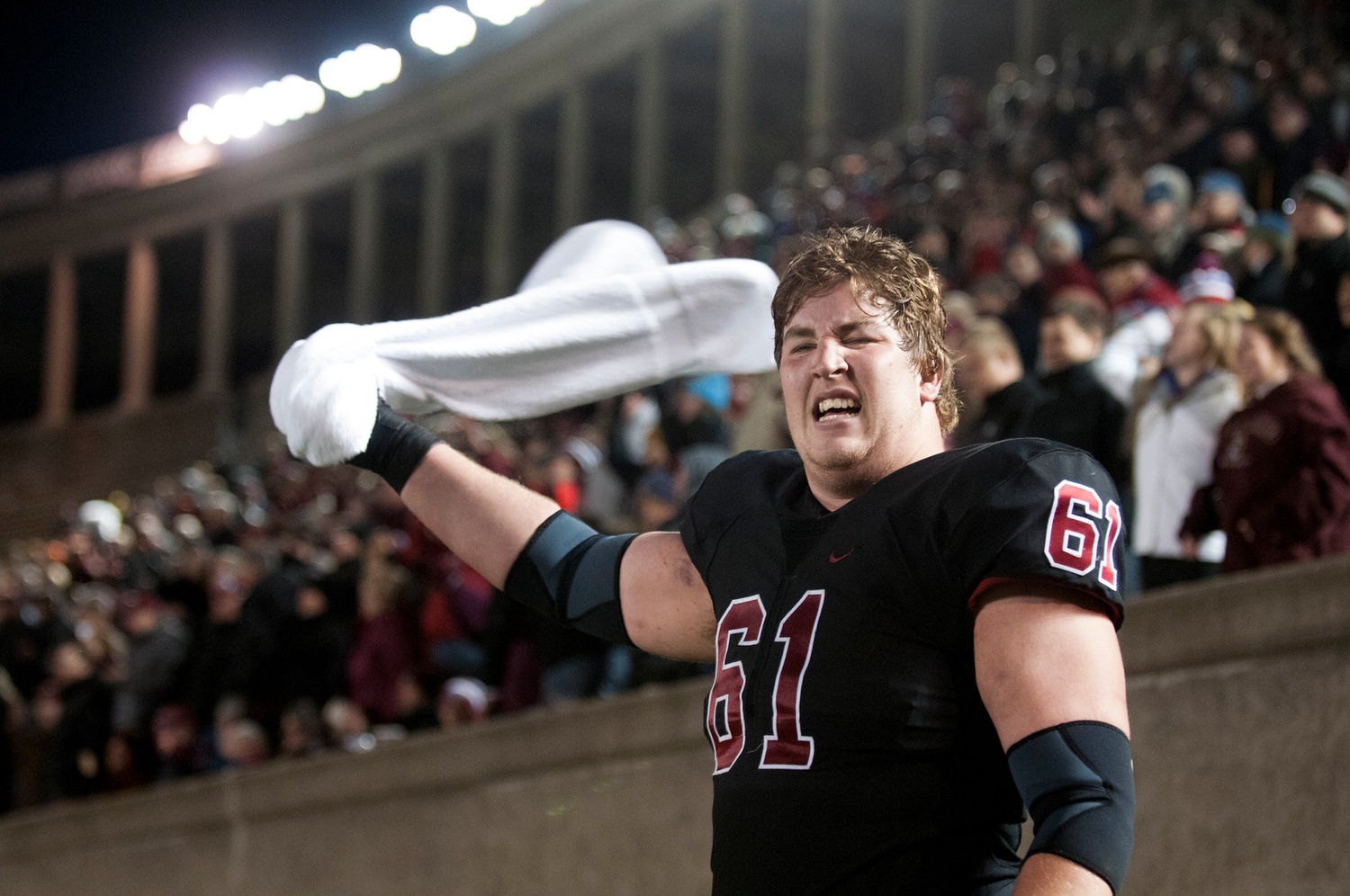 Senior offensive lineman Adam Redmond pumps up the fans as the Crimson makes its fourth-quarter comeback.