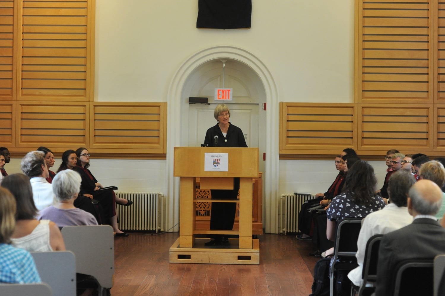 Drew G. Faust, the President of Harvard College, leads morning prayer in Holden Chapel Wednesday morning. Among other things, Faust spoke about utilizing Harvard's past to build a better future.