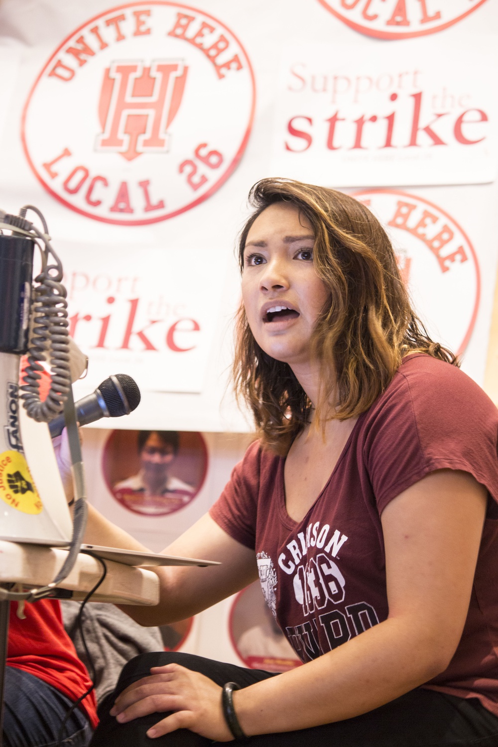 Camille E. Traslavina ‘18 speaks as part of a panel in support of HUDS before the march.