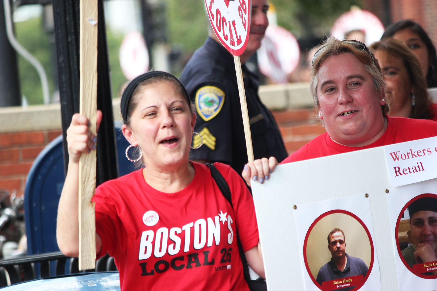 Members of the Local 26 union march down Massachusetts Avenue at Wednseday's HUDS rally. 