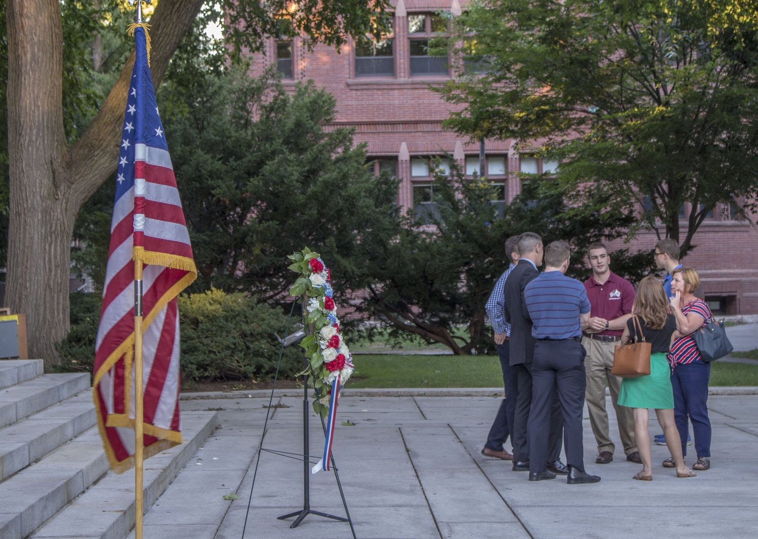 Harvard ROTC members and their families, along with students and faculty, gather for a 9/11 memorial at the Memorial Church steps Sunday evening. The event, which featured a speech by Dean of the College Rakesh Khurana and a wreath laying ceremony by Harvard ROTC, was in remembrance of the 15th anniversary.