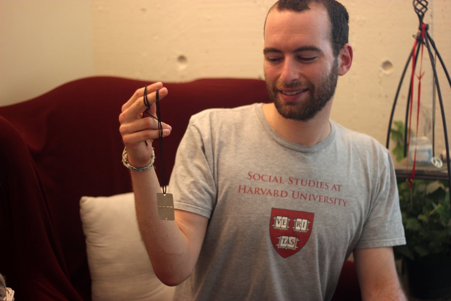 Giora A. Ashkenazi with his dog tag from his time serving in the Israeli military. 