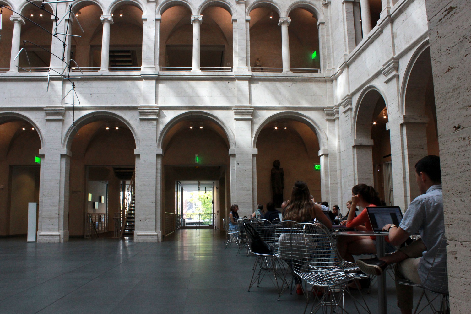 Students work in the foyer of Harvard Art Museum.