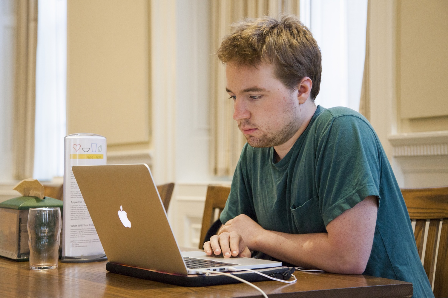 Wyatt T. Mackey ‘18 works on his laptop in the Leverett Dining Hall Thursday afternoon. Leverett House has experienced a number of laptop thefts in recent weeks.