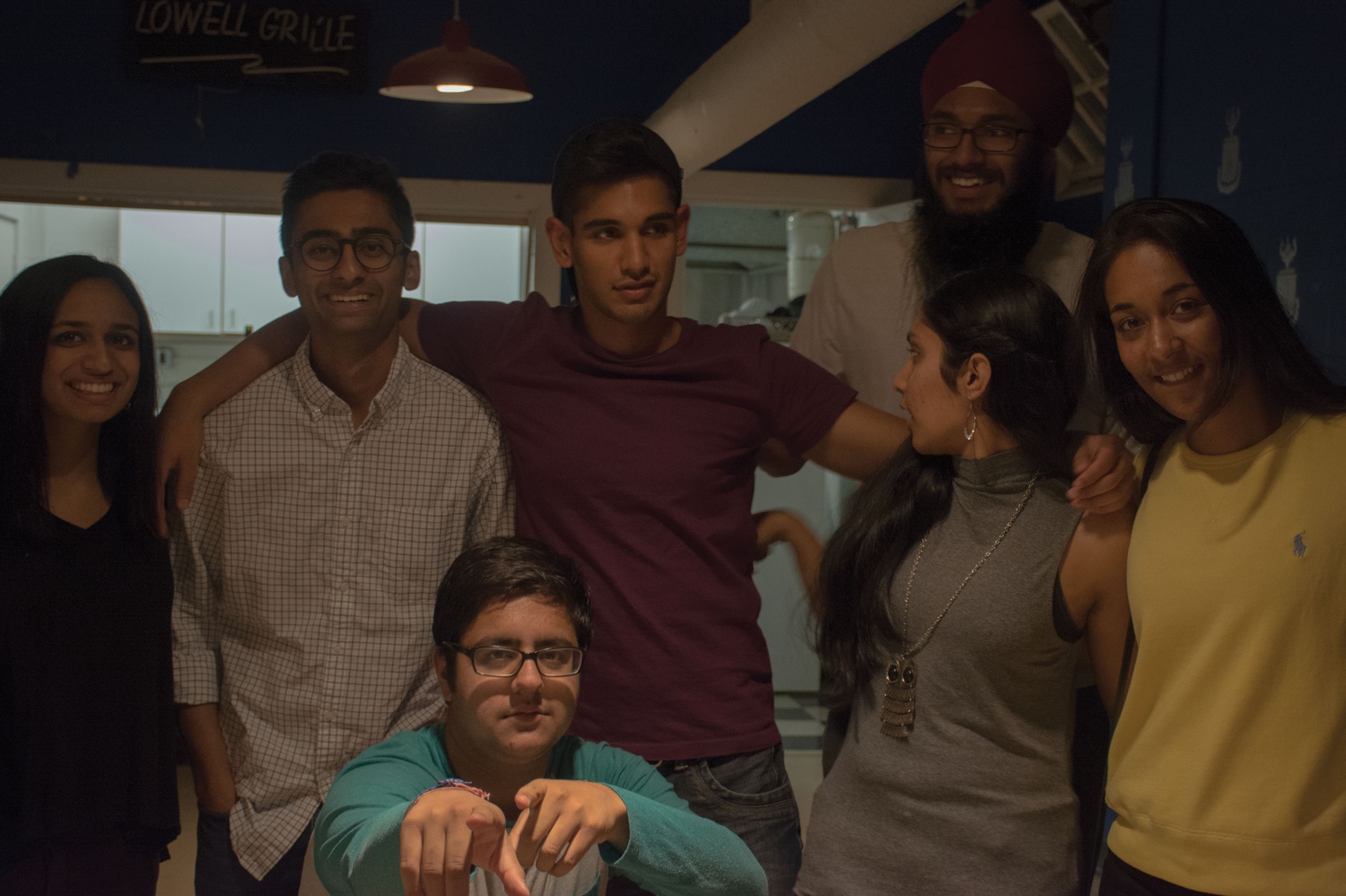 The Harvard South Asian Association board poses for a picture as they prepare to host InSAAnity in Lowell Grille Saturday evening. 