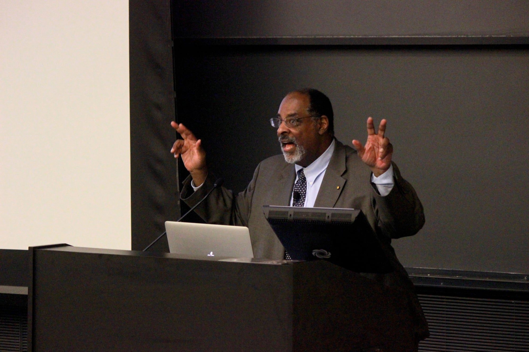 Joseph L. Graves discusses the legacies of former Harvard professor Louis Agassiz and Charles Darwin’s legacies in Northwest Labs Tuesday night. The talk was part of a speaker series put on by the Peabody Museum for their 150th anniversary. 
