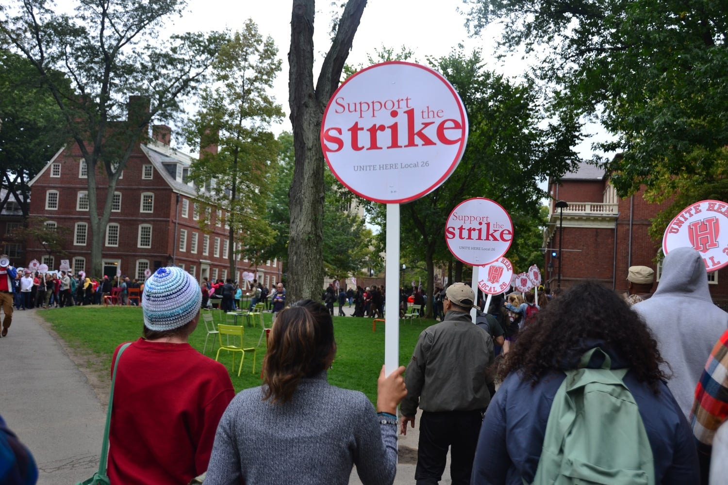 Chanting "No justice, no food," more than 400 Harvard affiliates marched in support of HUDS workers Friday afternoon in Harvard Yard. 