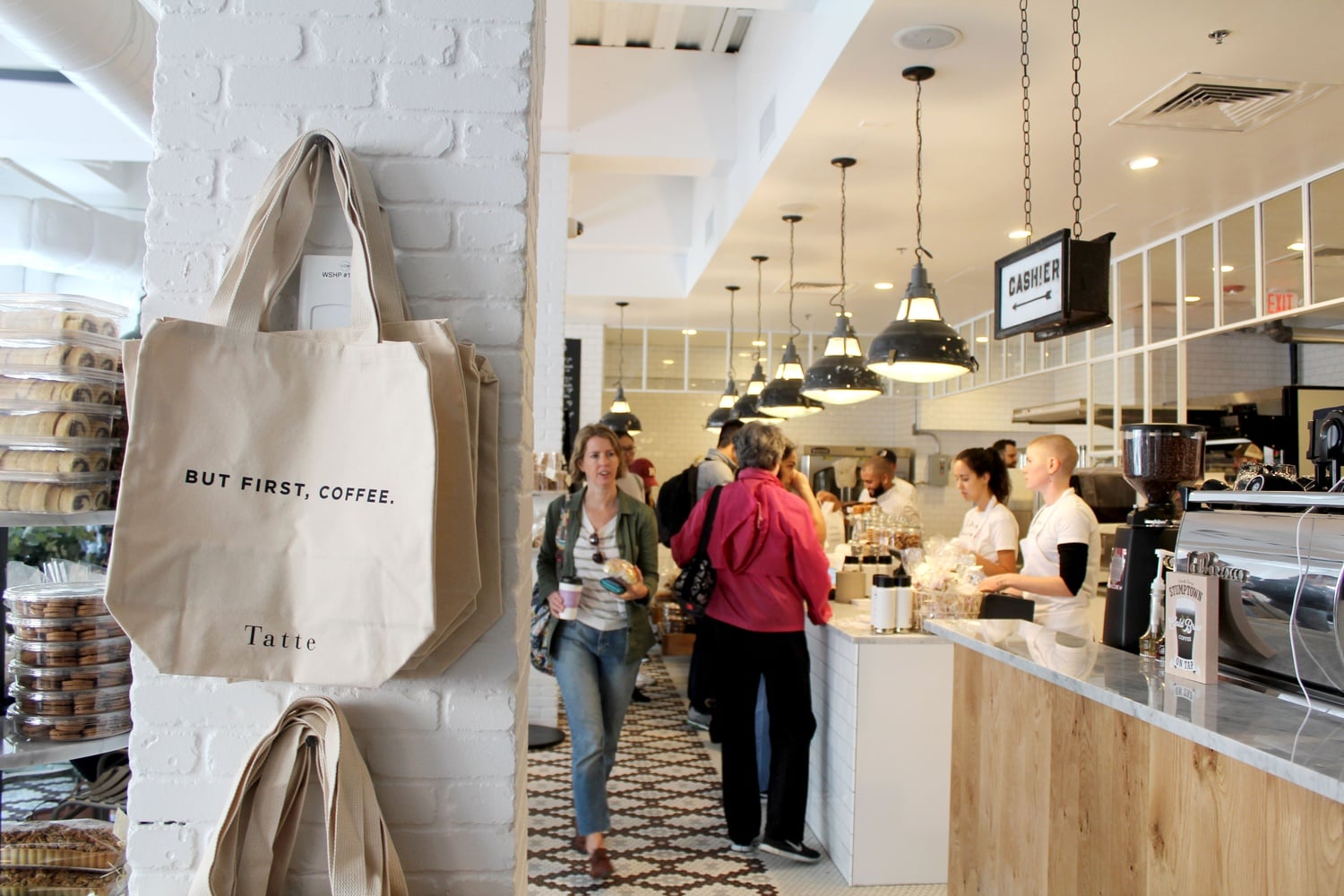 Boston-based bakery Tatte opened its doors in Harvard Square for the first time Tuesday, attracting students and locals for baked goods, coffee, and sandwiches.