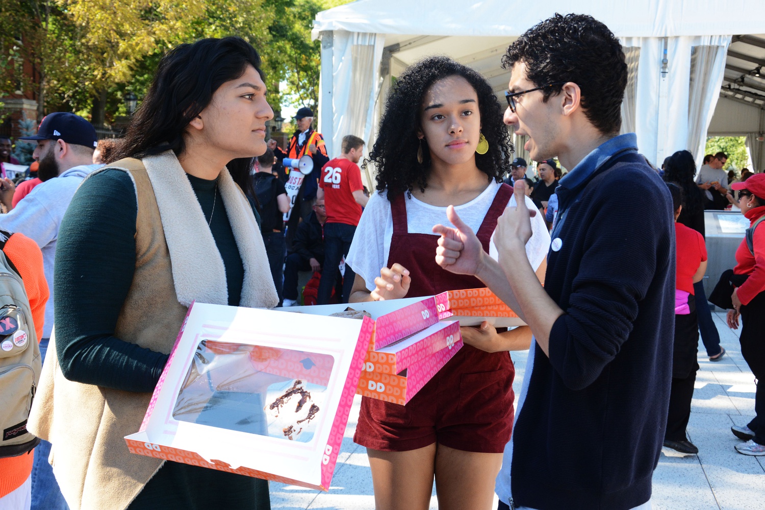 UC President Shabia Rather ’17 helps distribute donuts to HUDS workers on Thursday afternoon 