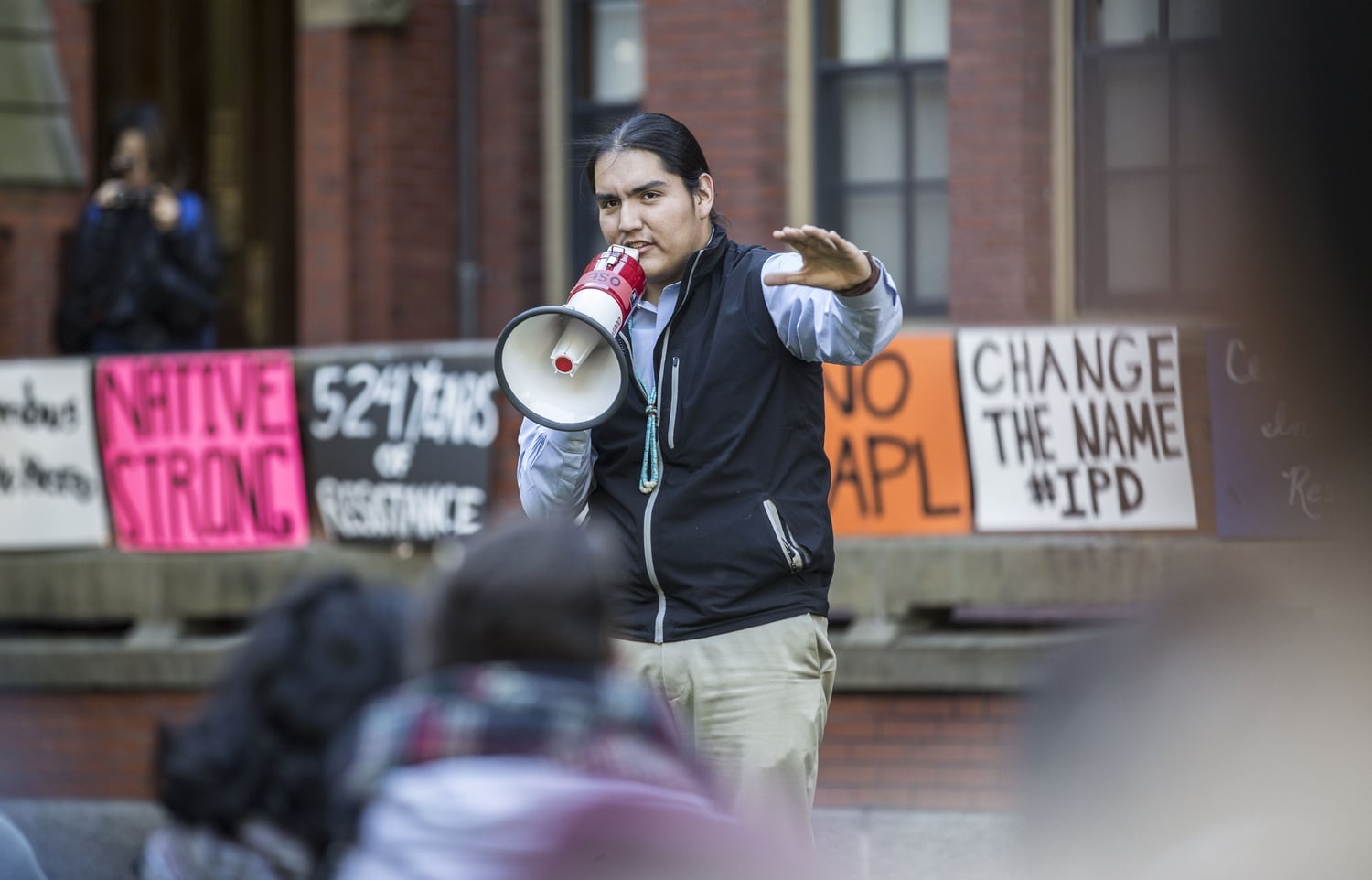 Damon J. Clark '17 speaks at the Indigenous Peoples' Day event Monday afternoon, hosted by the Native Americans at Harvard College student group. The event's purpose was to celebrate Indigenous cultures as well as to encourage supporters to sign a petition urging the University to acknowledge Indigenous Peoples' Day.