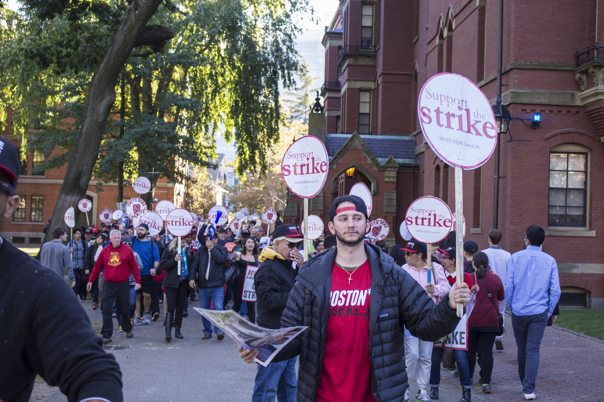HUDS workers, members of UNITE HERE Local 26, and other HUDS supporters rally in Harvard Yard on Friday afternoon.