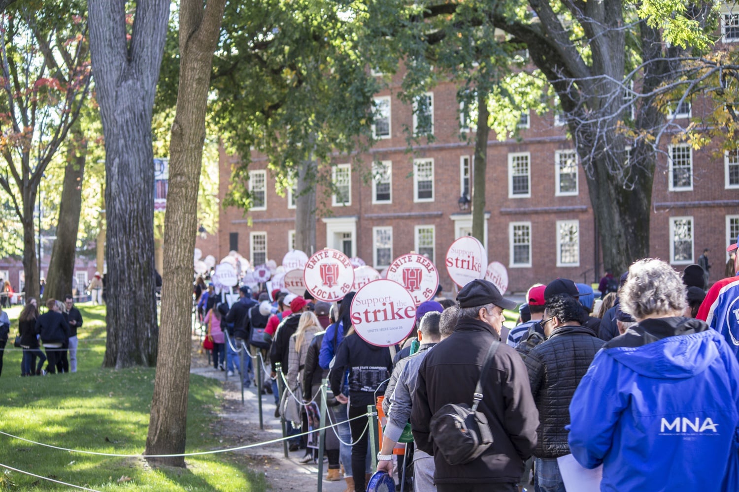 HUDS strikers and supporters march through the Yard from the Science Center Plaza towards the Square.