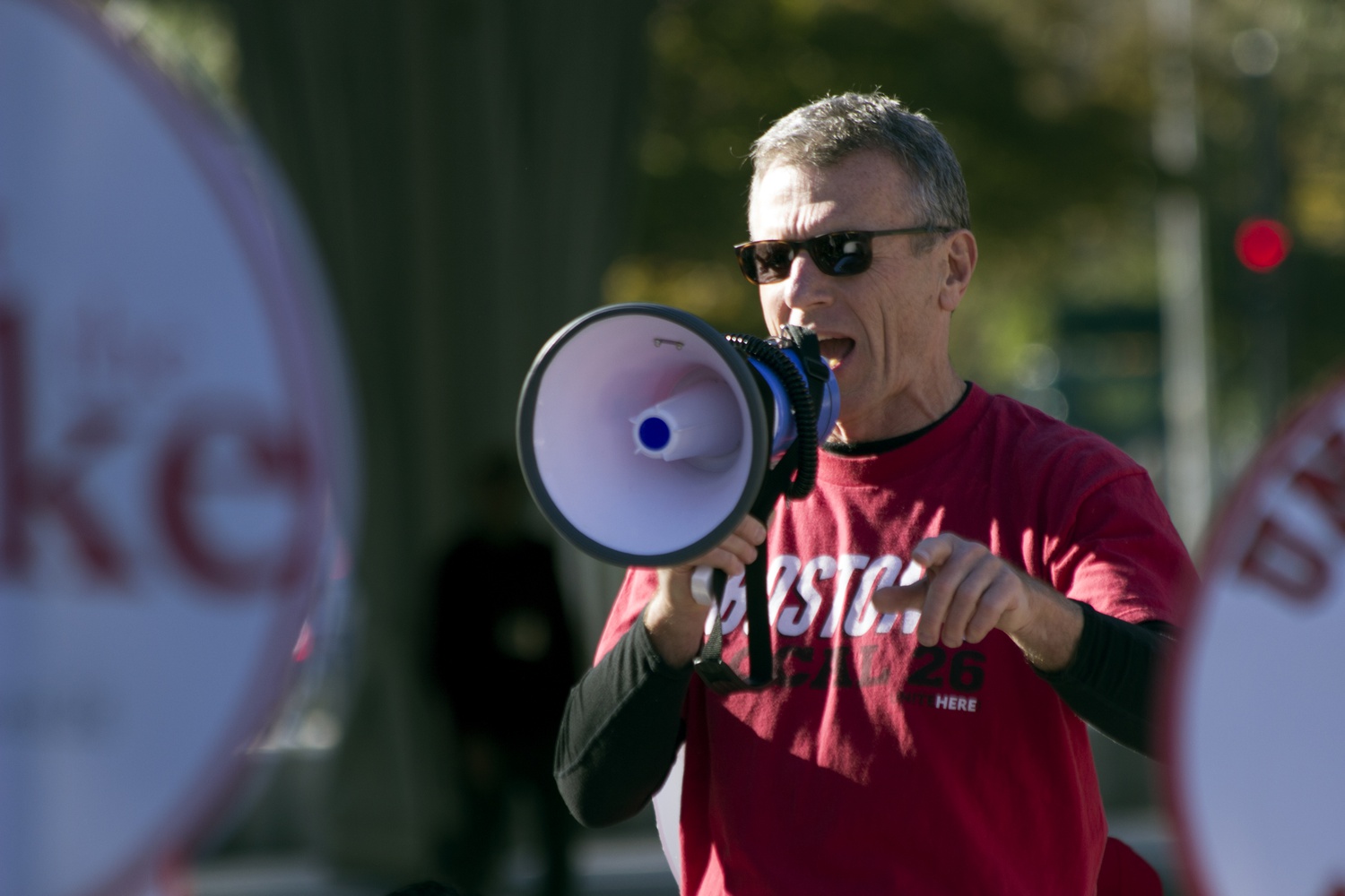 President of UNITE HERE Local 26 Brian Lang speaks to crowd of striking workers outside the Science Center Friday afternoon. Lang was later arrested by the Cambridge Police Department after blocking traffic in Harvard Square.