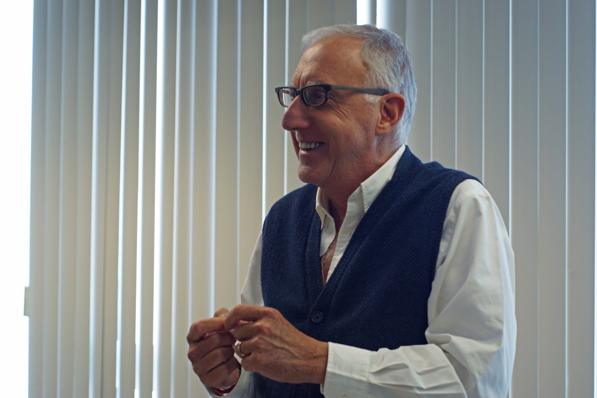 Isaac Kohlberg manages a staff of 50 who make all final decisions regarding Harvard's patents. Here, he laughs as he talks about forgetting his tie. 
