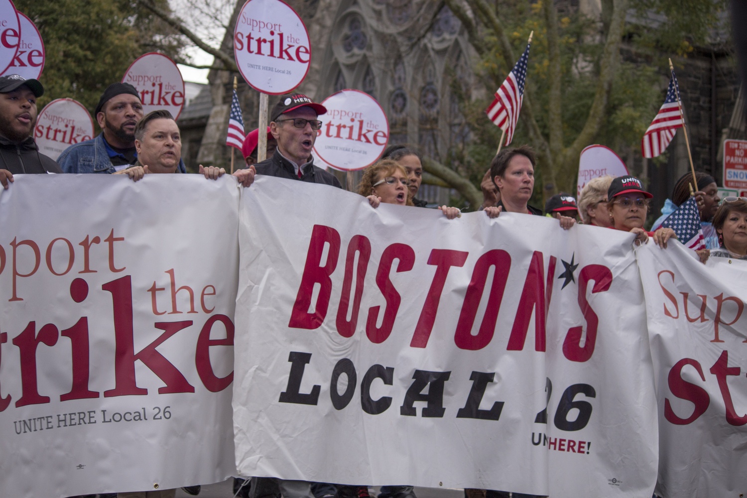 President of UNITE HERE Local 26, Brian Lang, Cambridge Vice Mayor McGovern, and HUDS striker Anabela A. Pappas march along with several hundred HUDS strikers and supporters.