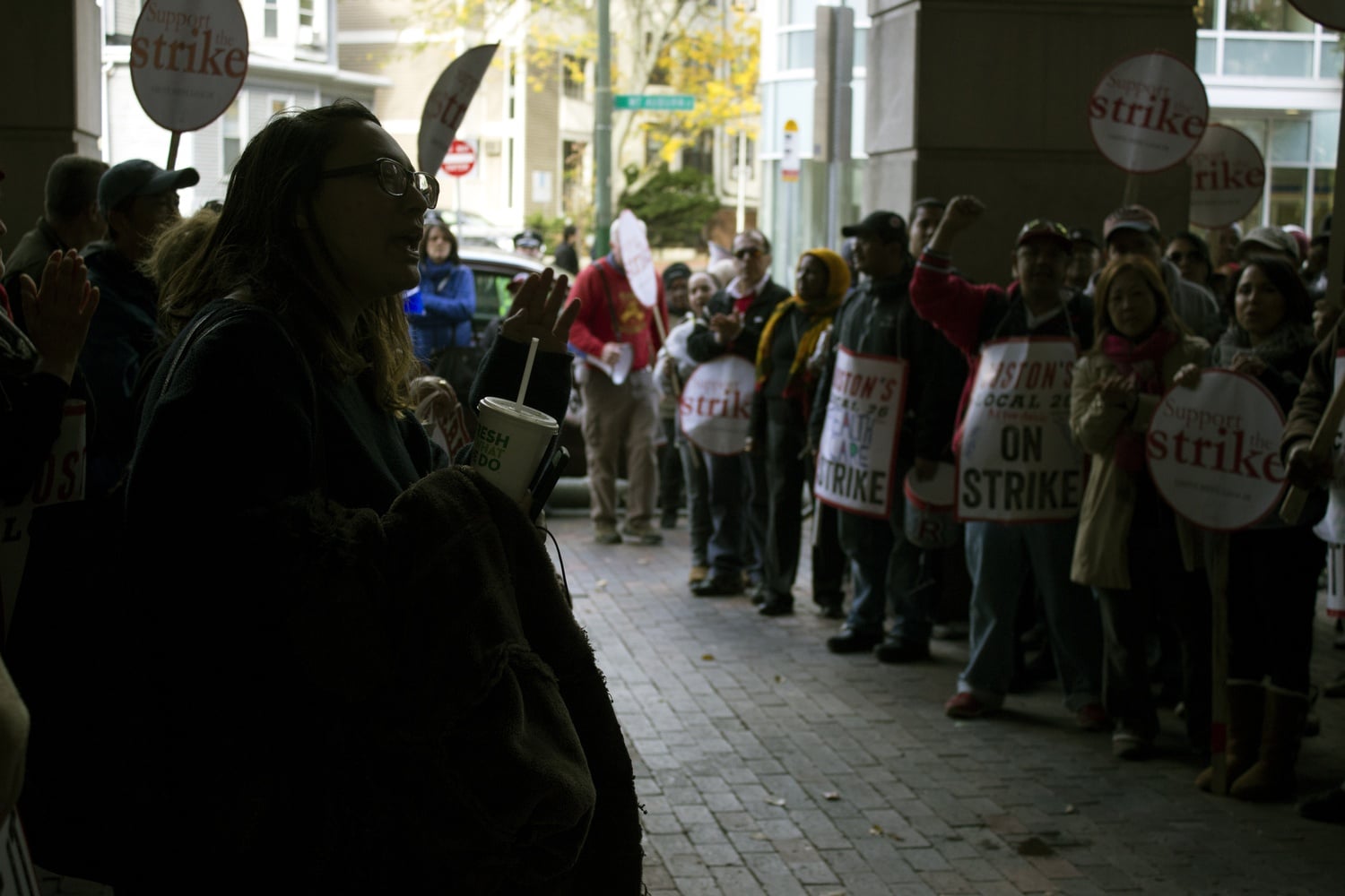Union supporters gather outside of 124 Mount Auburn St. during the Monday's protests.
