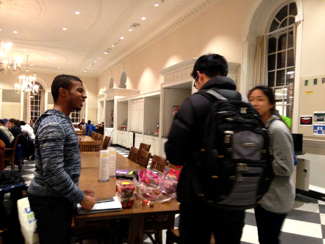 Paul M. Lewis ’18 serves berries to students in Leverett Dining Hall as part of a Healthpals study break preceding the flu clinic that will happen there Wednesday. Many houses had their flu clinics rescheduled due to the strike.