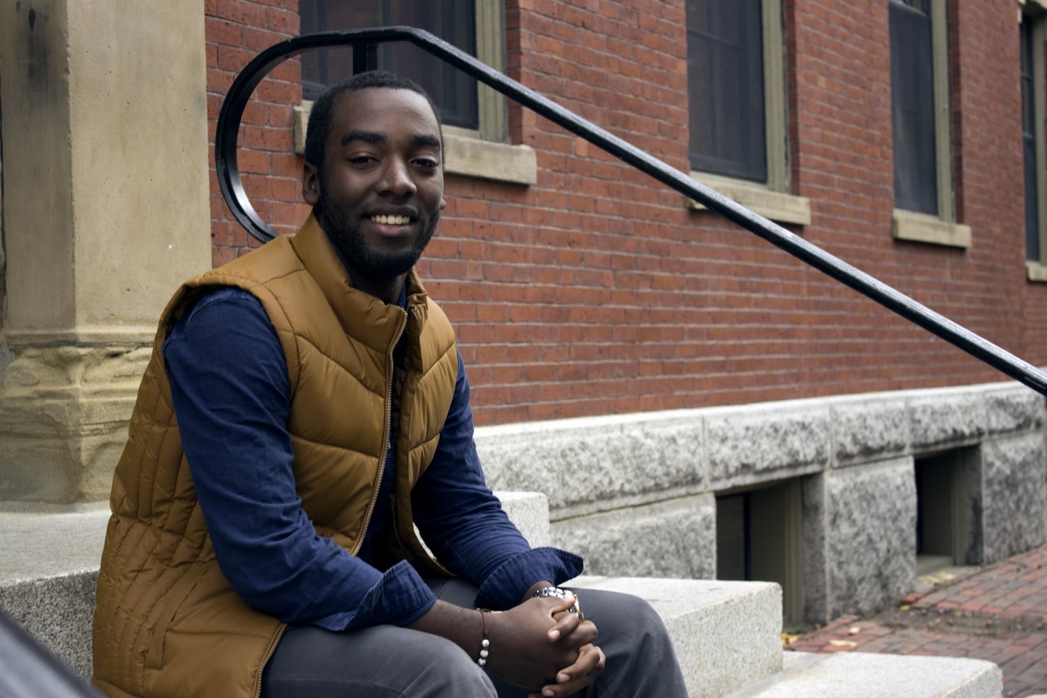 As the Harvard College Democrats’ Campus Outreach Director, Devontae A. Freeland ‘19 has helped lead canvassing efforts in New Hampshire. Freeland, also a member of The Harvard Foundation, poses outside of the foundation’s office in Thayer Hall.