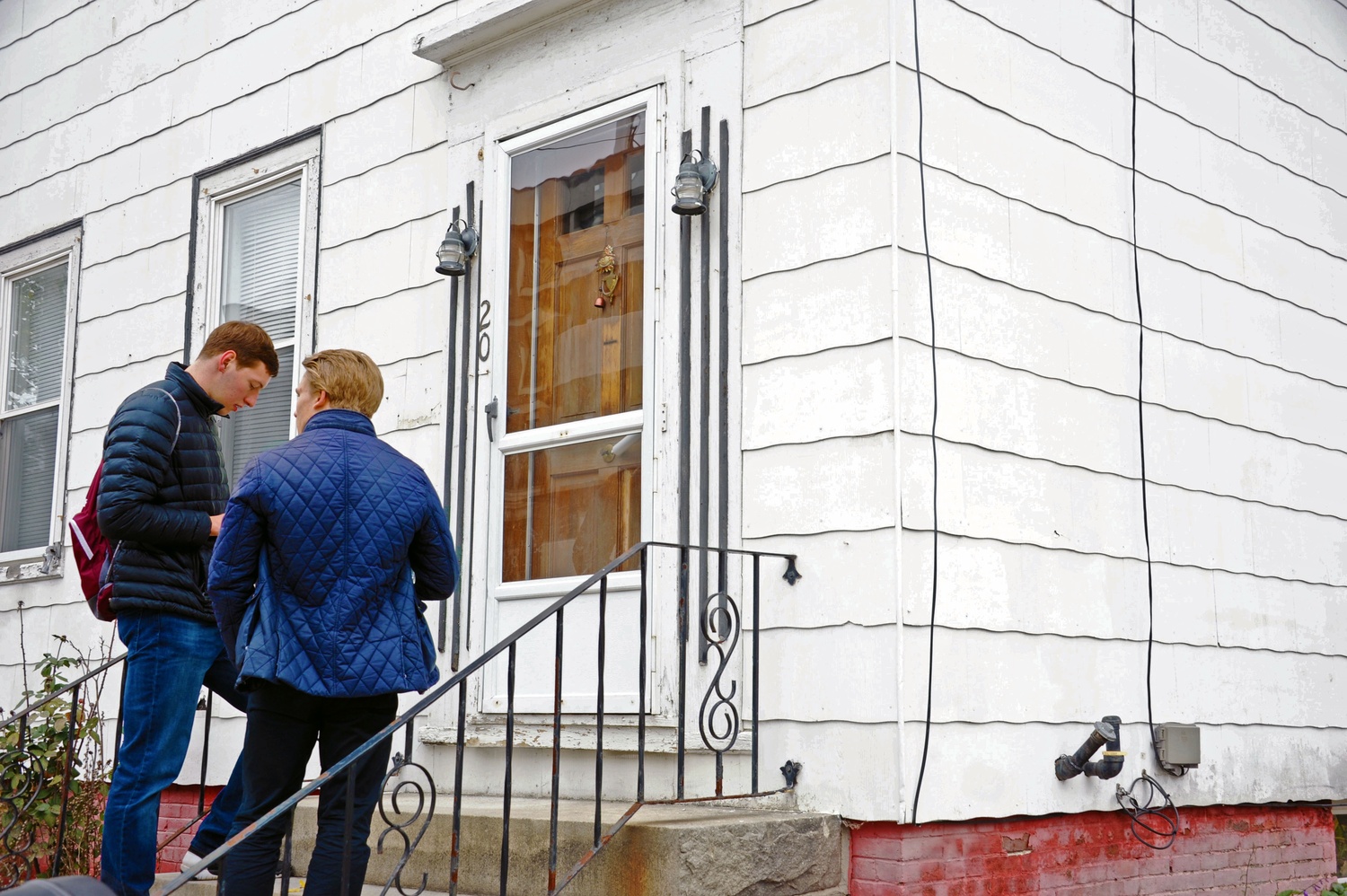 Kent K. Haeffner '17 (left) and Dustin L. Zacharias knock on a door in Laconia, New Hampshire, canvassing for the Republican Party. They were not canvassing in support of Donald Trump, however. Instead, they were rallying support for the New Hampshire senator Kelly Ayotte.