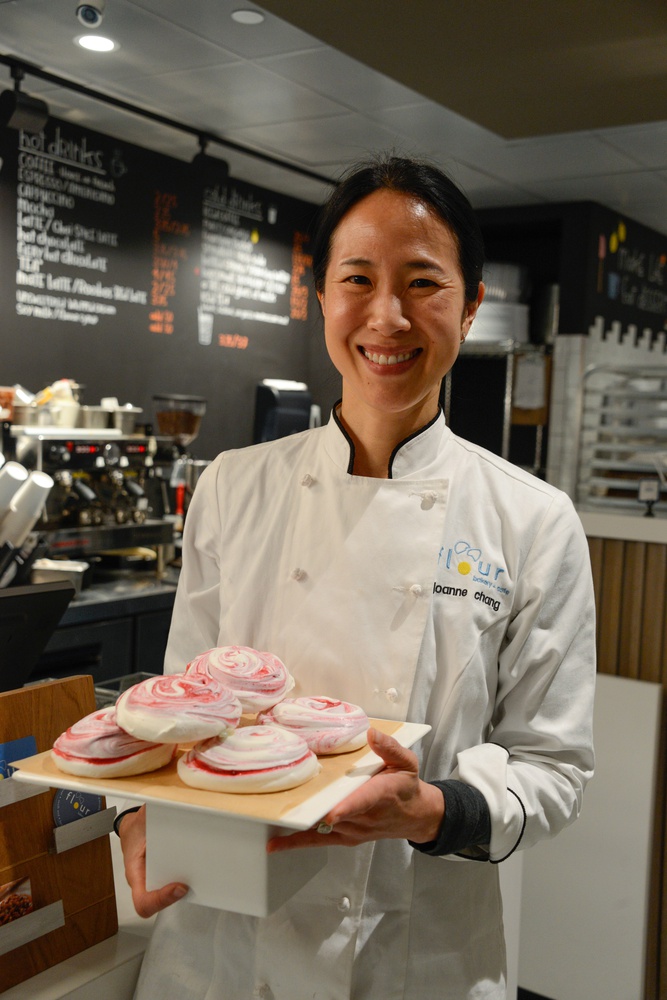 Joanne Chang, founder of Flour, poses with some of her baked goods.