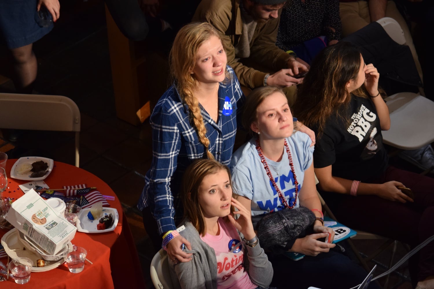 Caroline M. Tervo ‘18, Sally C. Marsh ‘18 and Megan K. Mers ‘17 comfort each other as the election results come in on Tuesday night at the IOP watch party.
