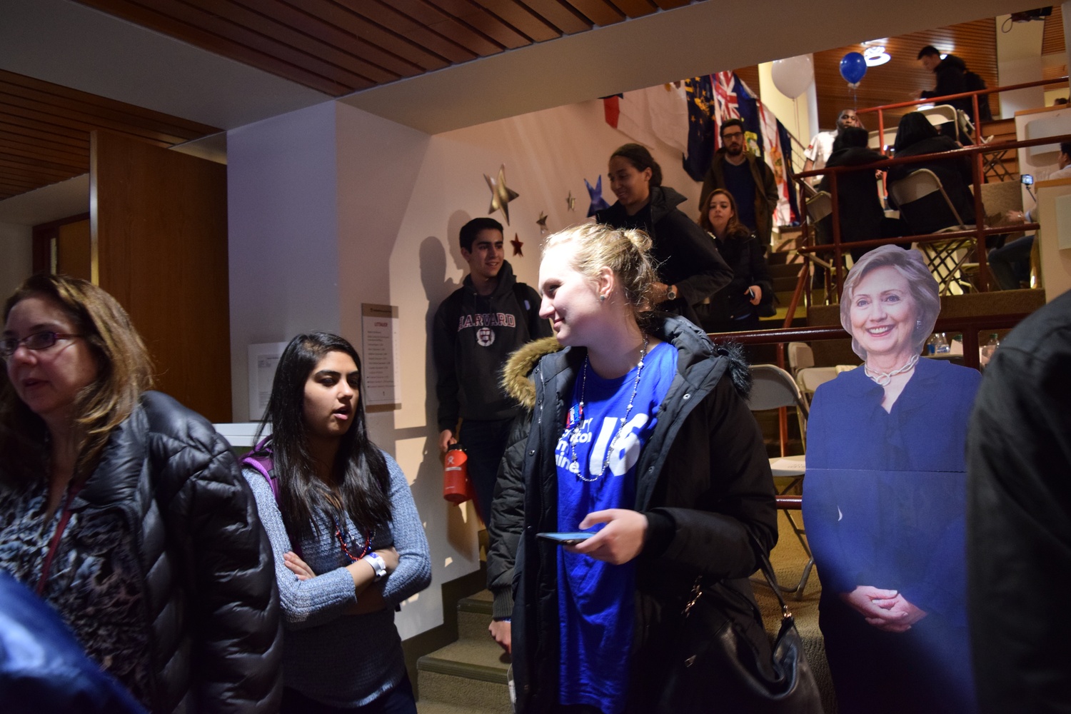 Isabel R. Steinhaus ‘18 talks to Nida Ansari ‘18  discuss the election results while passing in front of a cardboard Hillary Clinton on the way out of the IOP election watch party on Tuesday night.