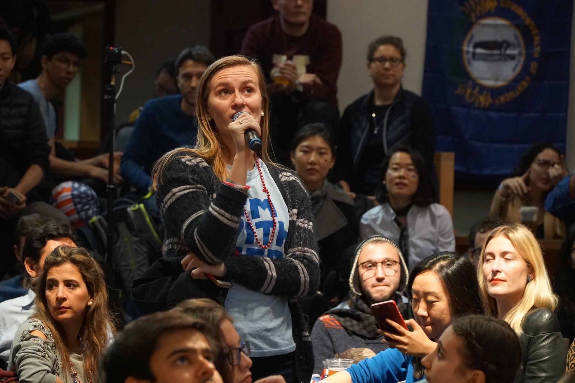 Caroline M. Tervo ’18 asks a question at the IOP election night watch party on Tuesday. The celebration ended at midnight without the planned balloon drop and declaration of victory expected by students and other attendees.