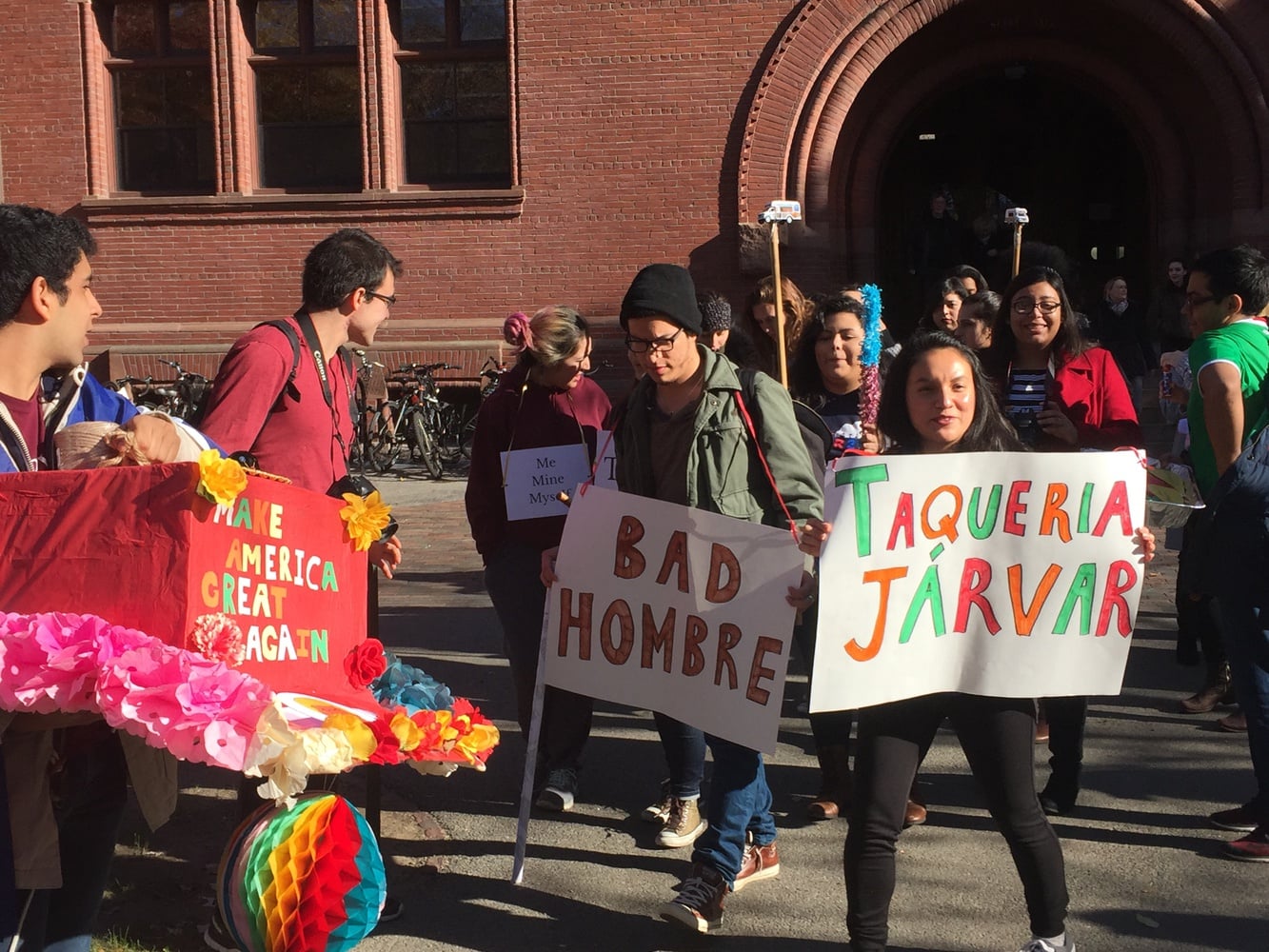 Students in Spanish 126: Performing Latinidad process through the yard on Monday as a part of a performance piece exploring experiences of Latinos in the United States. The procession made stops around Harvard Yard for a poetry reading, a coordinated spoken word piece, and other acted performances commenting on anti-Latino discourse in the 2016 presidential election. 