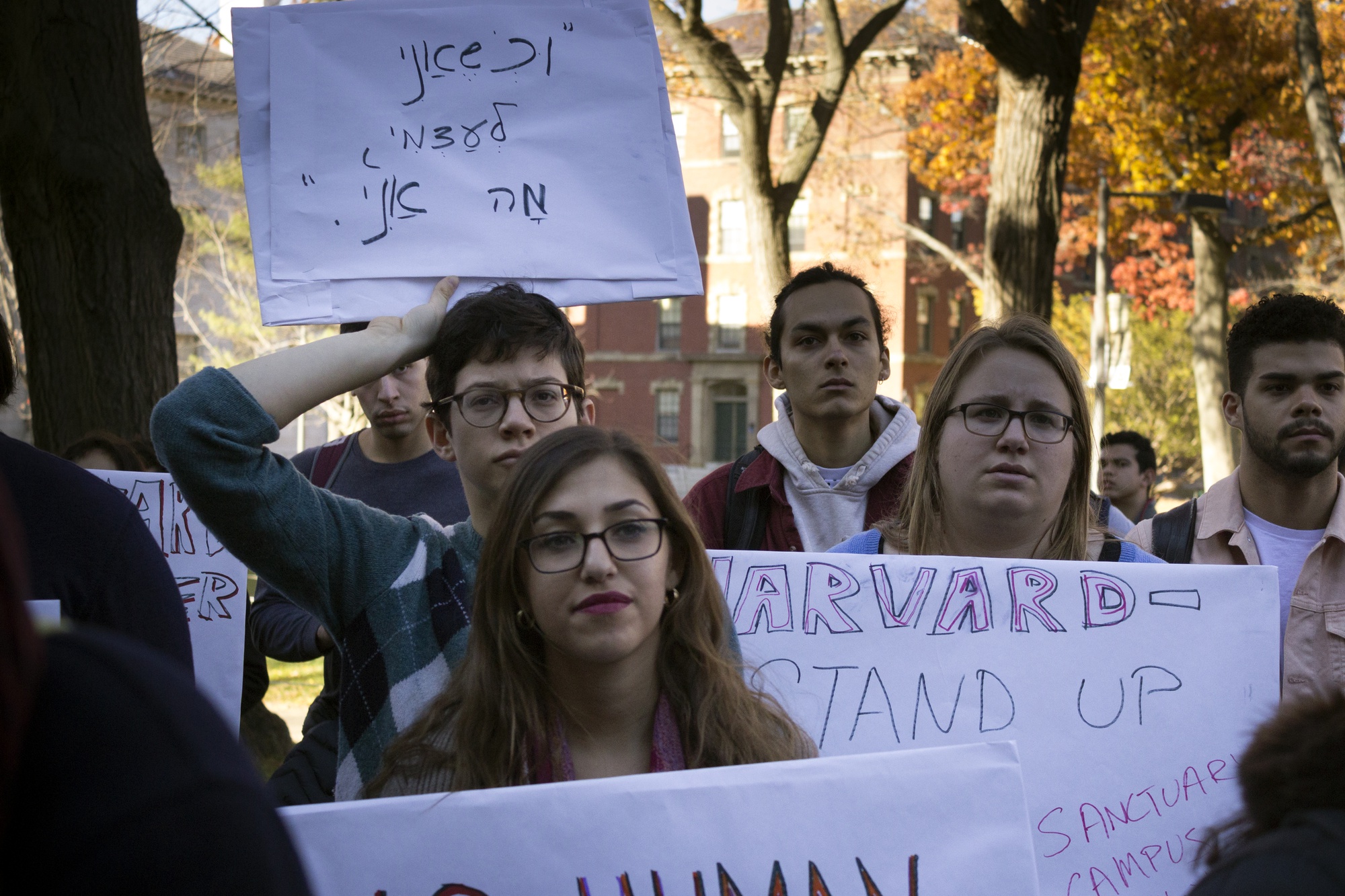 More than 100 supporters gather on the steps of Widener Library to advocate for the defense of undocumented students at Harvard. 