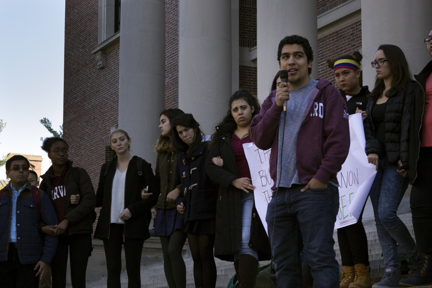 Bruno Villegas '19 speaks on the steps of Widener Library.