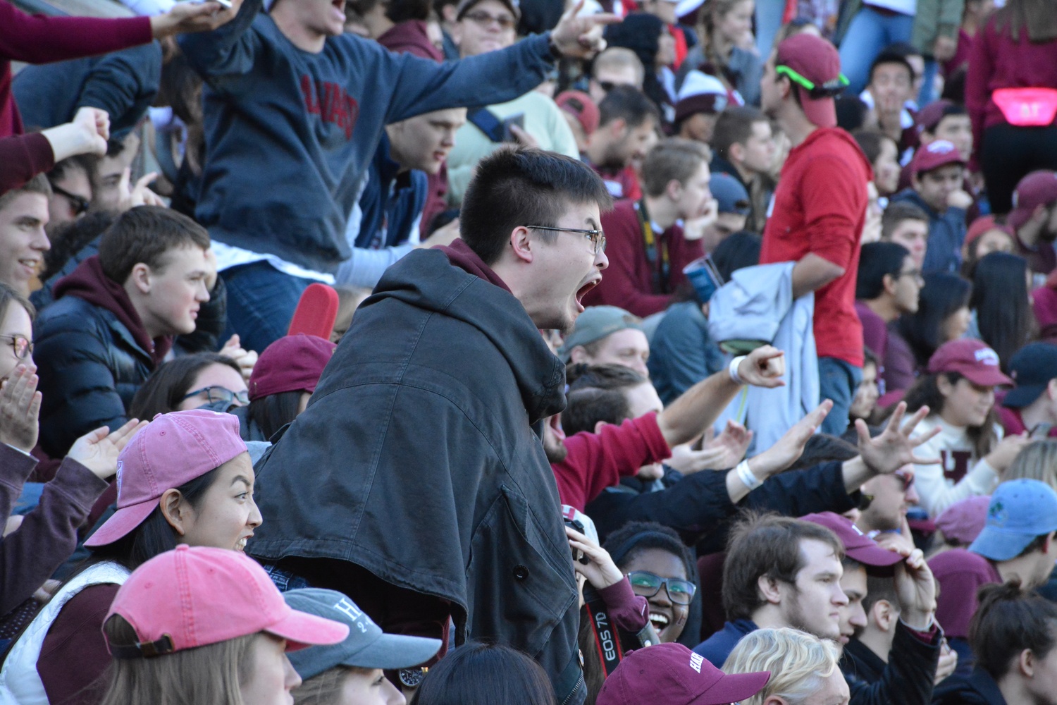 Brandon L. Snyder ’18 cheers on the Crimson during the first half of the Harvard-Yale game Saturday. Harvard ultimately lost 14-21.