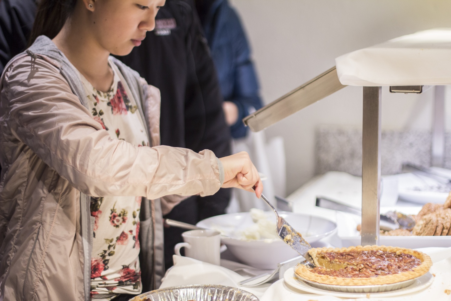 Students enjoy the assortment of pumpkin, apple, and pecan pies in Quincy dining hall on Thanksgiving. HUDS prepared a classic Thanksgiving meal for students on campus during the holiday.