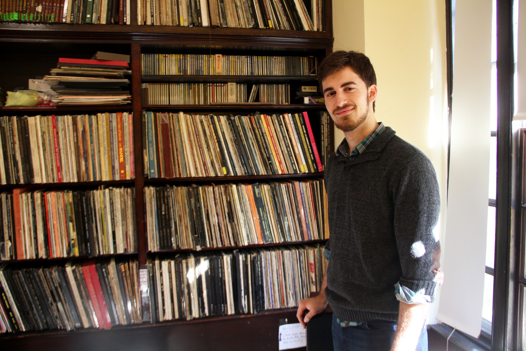 A resident of Eliot House and the house's official librarian, Tim runs the record room, the recording studio, and the Eliot bike-sharing program. Here, he stands in the record room after putting on Chopin's Nocturne No. 1.