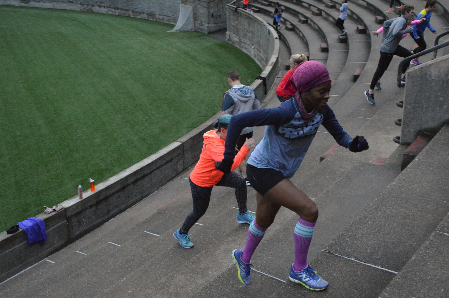 Cambridge resident Sheree Watson climbs up the steps of Harvard Stadium early on Wednesday morning.  Watson has been participating in the November Project since September.