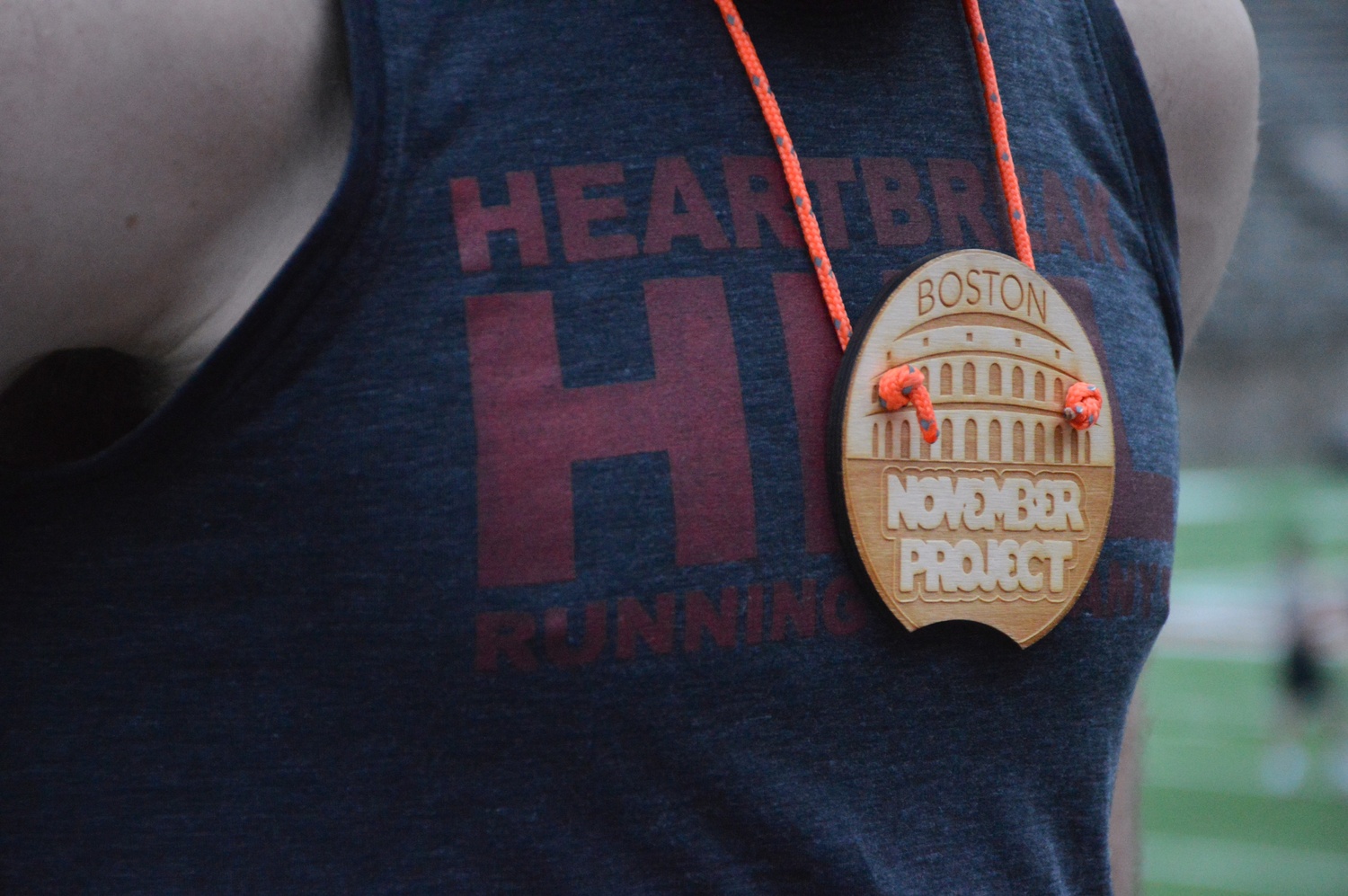 Conor Hayden wears one of twelve “NP High Five” medals.  According to Hayden, November Project participants pass the medals to other members “as a way of recognizing someone who embodies what NP stands for.
