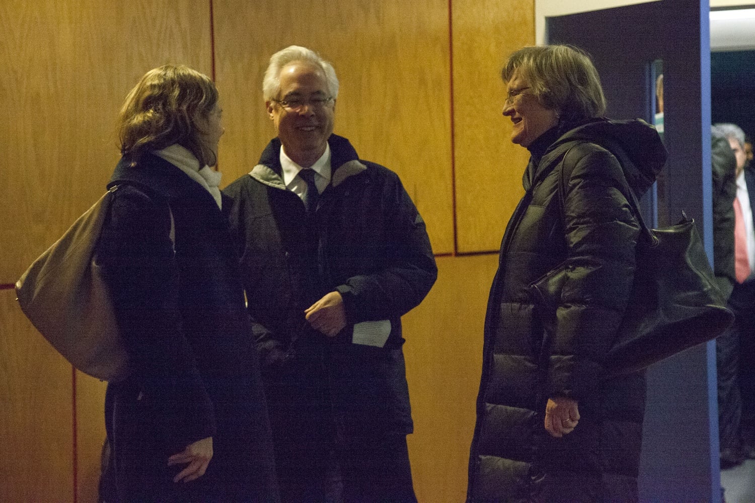 Philosophy professor Alison Simmons, English professor Louis Menand and University President Drew G. Faust talk after the December Faculty meeting during which the vote on the sanctions motion was tabled