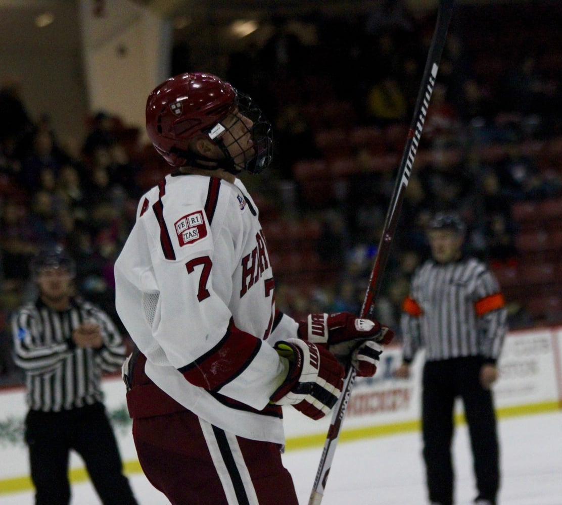 Junior forward Eddie Ellis skates to the Harvard bench after scoring his first goal of the season.
