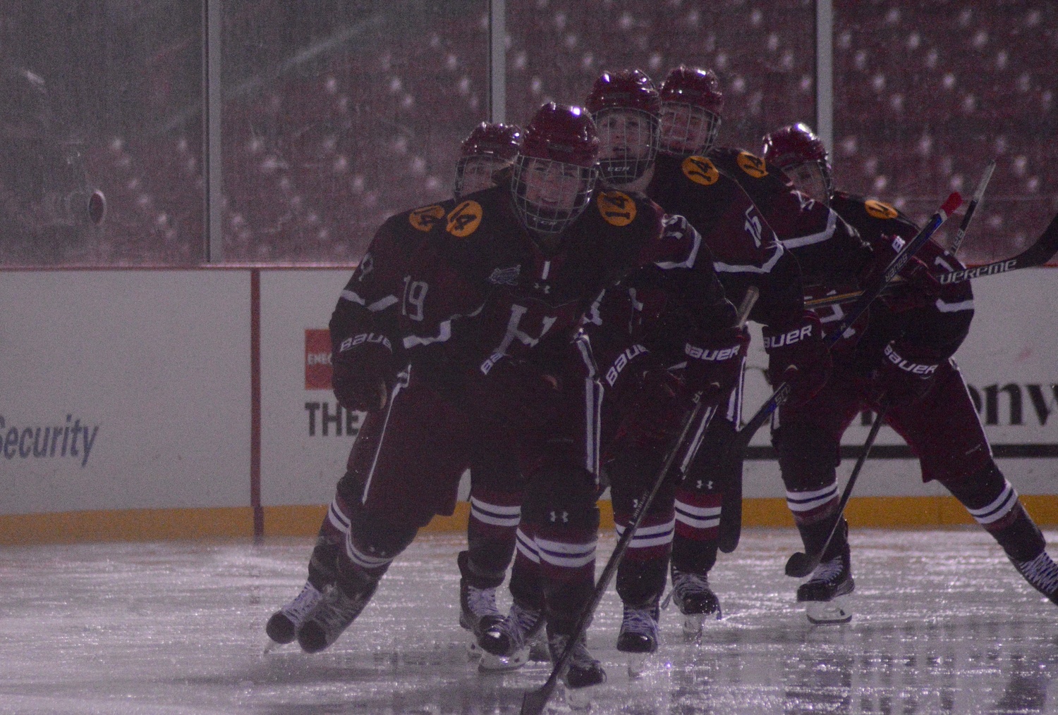 Kat Hughes and company skate back to the bench after the freshman scores Harvard's first goal of the night.