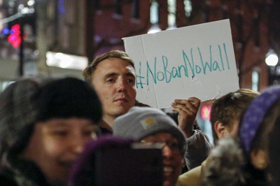 Cover image for Over 150 Join 'Emergency Protest' of Immigration Order