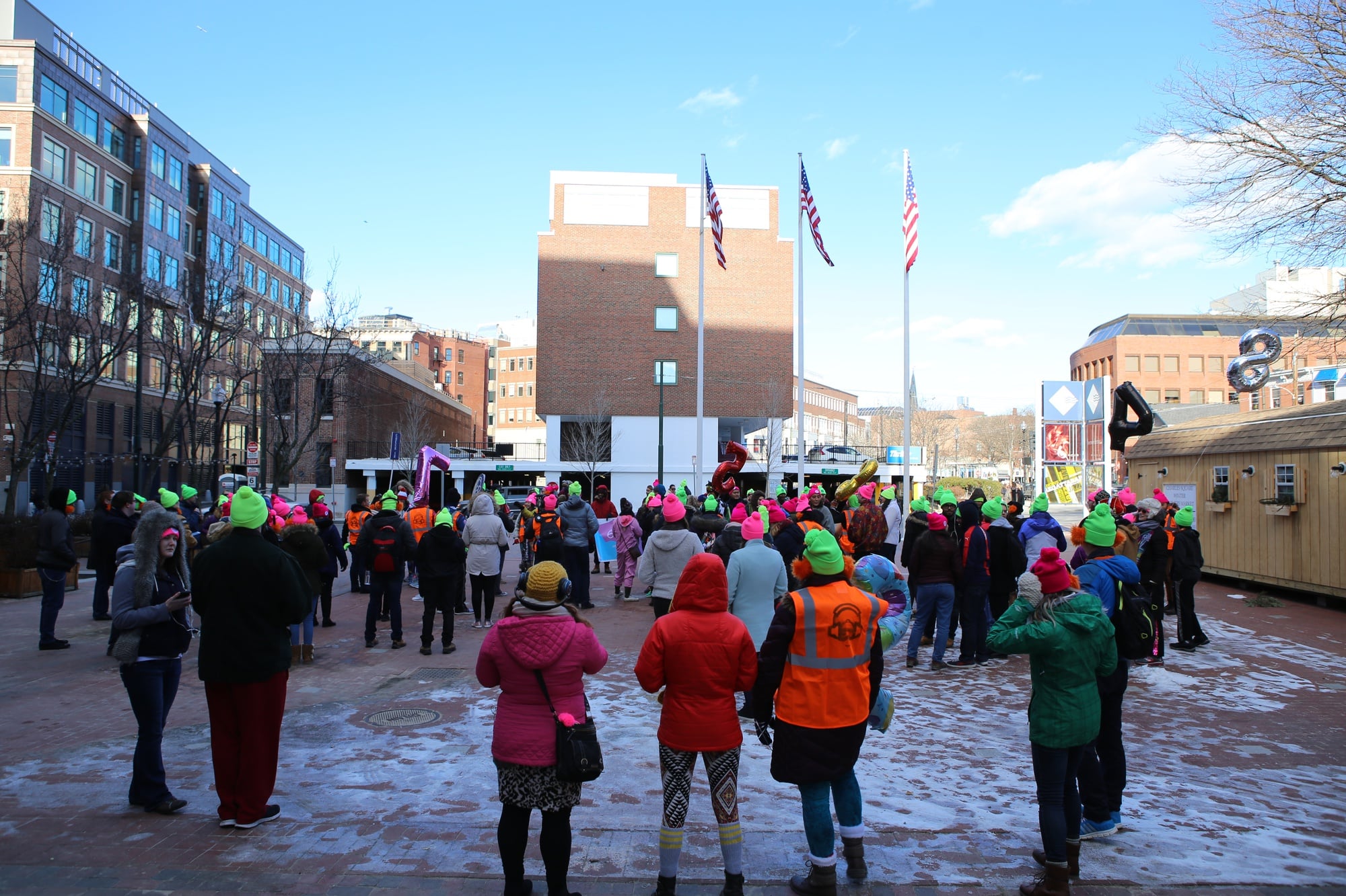 On Saturday afternoon, dozens of warm-spirited people gathered in bright neon hats, earbuds, and their coziest layers to dance through the Square in a “silent disco.”
