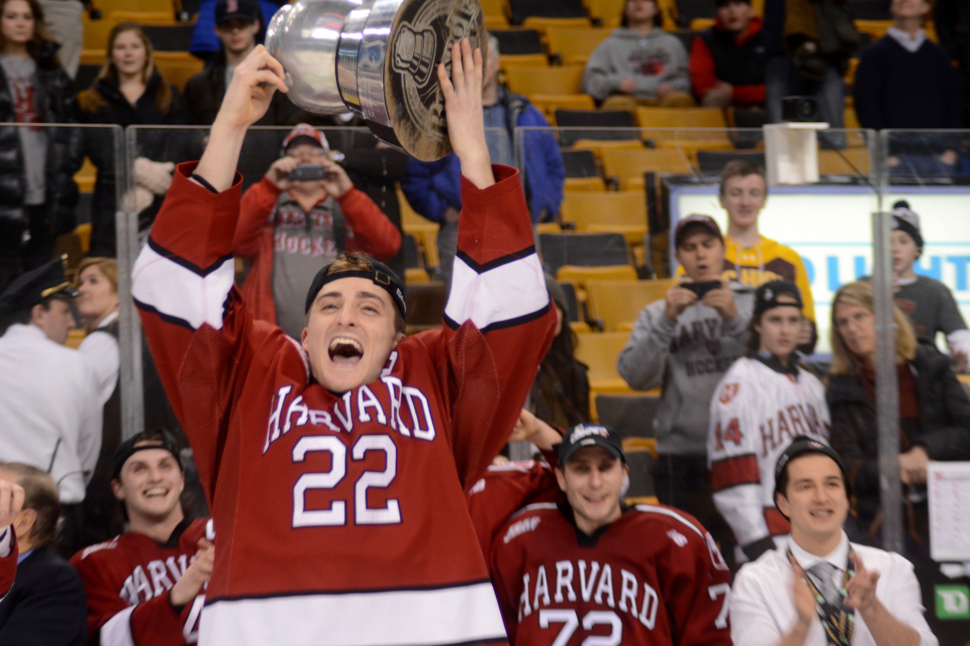 Co-captain Devin Tringale, a native of Medford, Mass., hoists his first Beanpot trophy.