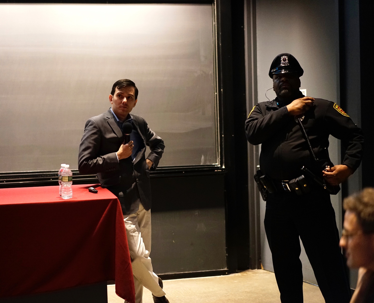 Martin Shkreli speaks in the Science Center on Wednesday night at an event organized by the Harvard Financial Analysts Club. Protesters disrupted the event, standing up, walking out, and encouraging others to move to a “teach-in” panel on AIDS treatment and unethical pharmaceutical practices.