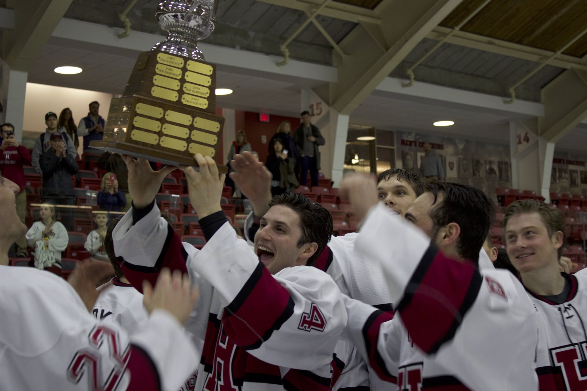 Co-captain Alexander Kerfoot celebrates with a stand-in replica for the Cleary Cup, given to the ECAC's regular season champion.