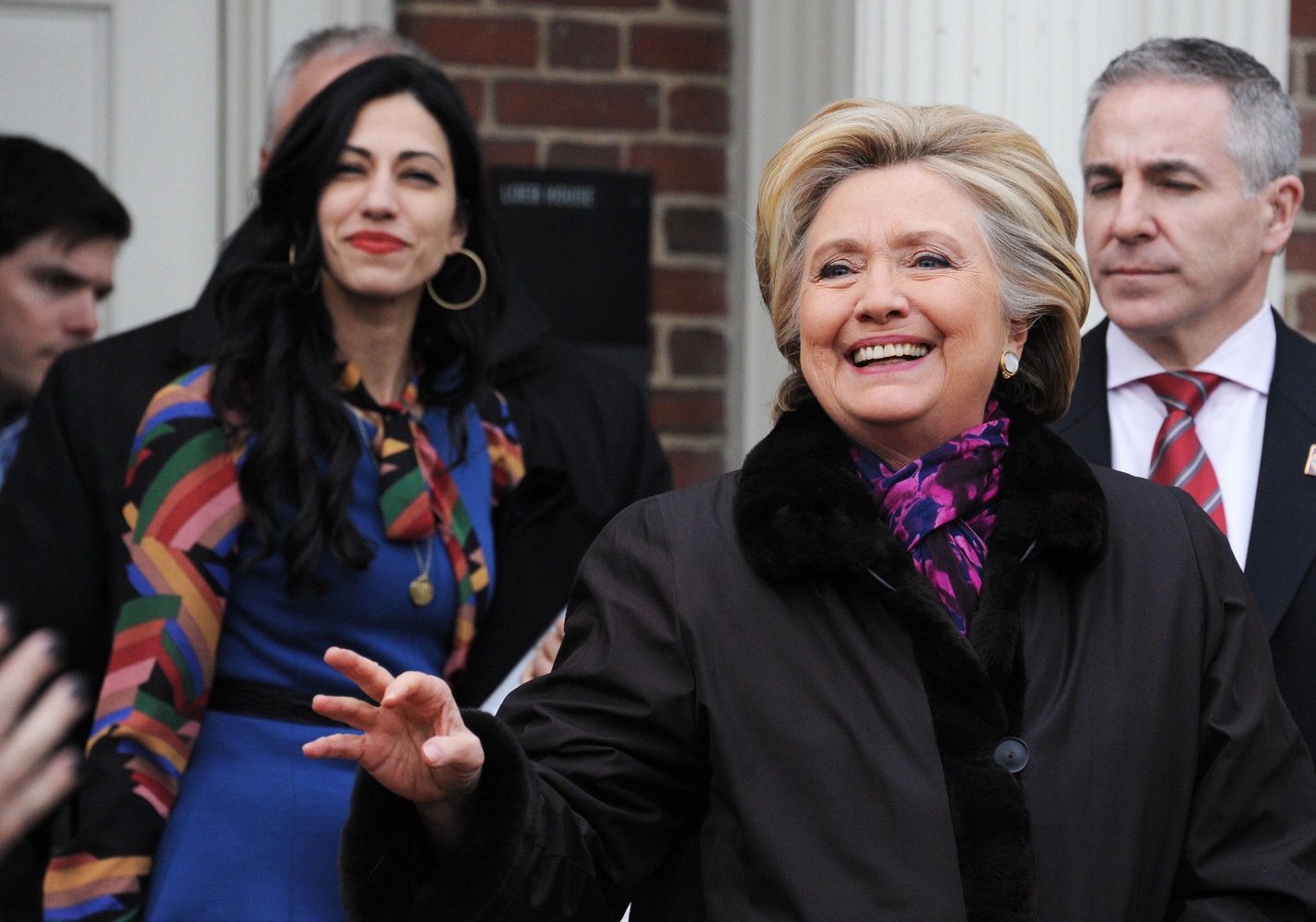 Hillary Clinton waves at a crowd of students gathered outside Loeb House on Friday afternoon. The former Secretary of State visited Harvard's campus to be interviewed as part of a joint Kennedy School, Law School, and Business School project.