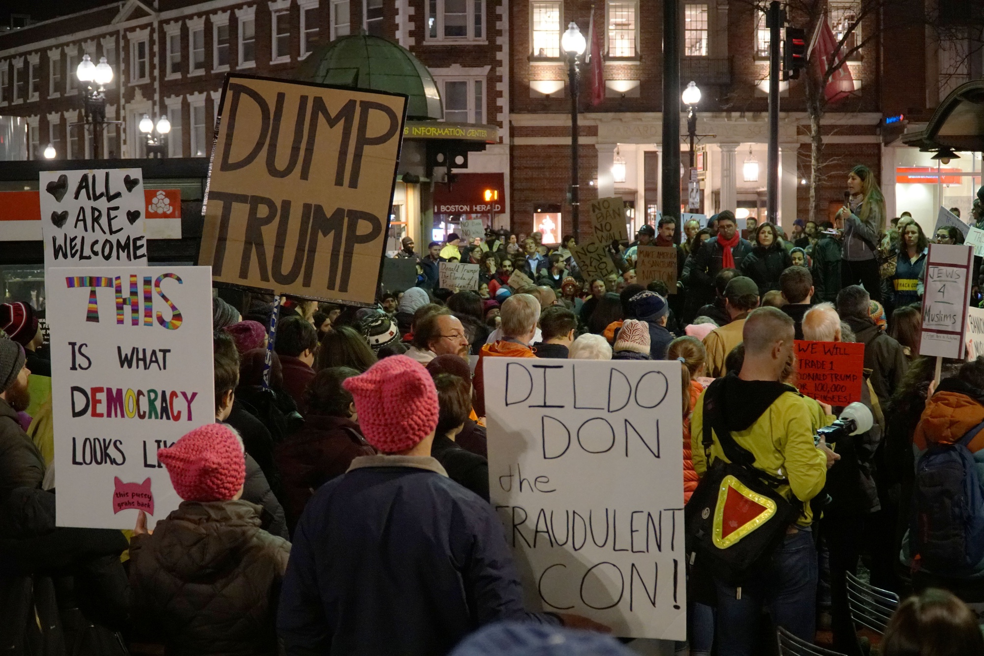 Members of the Anti-Islamophobia Network rally against President Trump’s recent travel ban executive orders Tuesday night at the Harvard T Station.